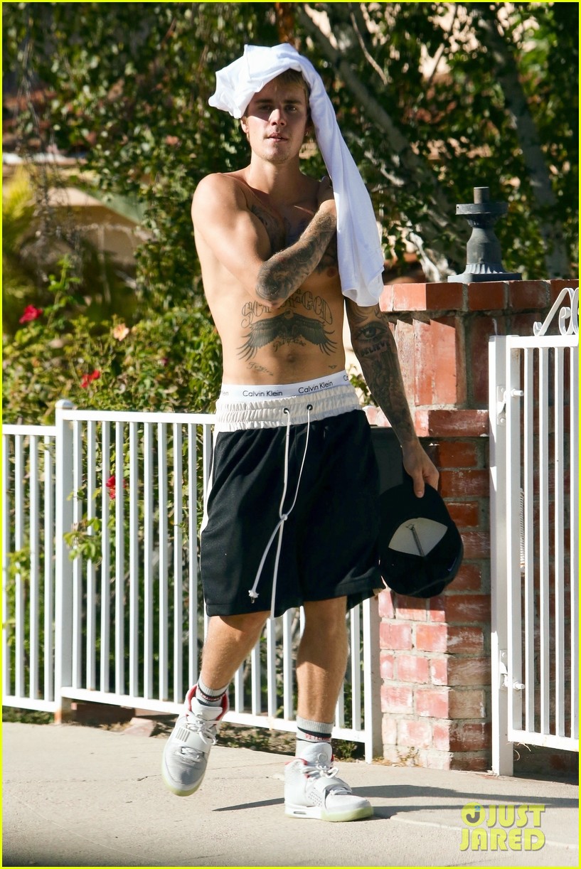 Justin Bieber Goes Shirtless And Flashes His Abs During Walk Around La