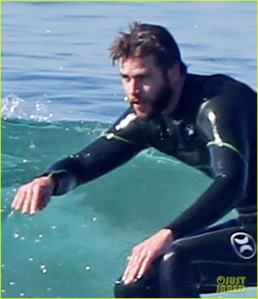 Shirtless Liam Hemsworth Shows Off His Muscles At The Beach 