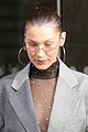 bella hadid goes bralass in a sheer top and two tone suit jacket 05