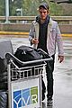 kj apa arrives in vancouver with mystery blonde 08