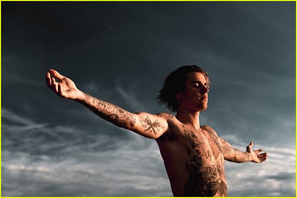 justin bieber shows off tattoos posing shirtless on the beach 02
