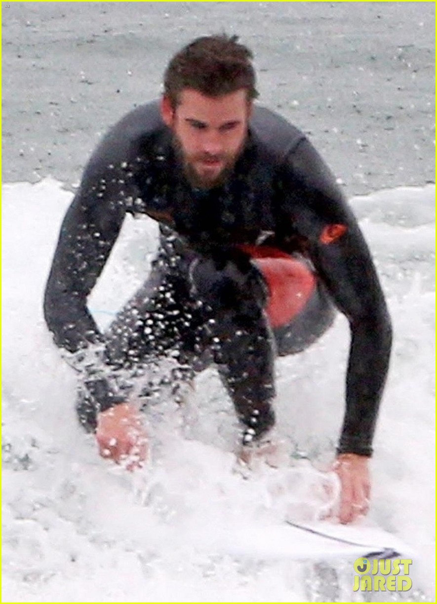 Liam Hemsworth Shows Off His Wetsuit Bod on a Rainy Day in Malibu ...