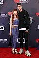 madelaine petsch gets a kiss from travis mills at iheart radio music awards 04