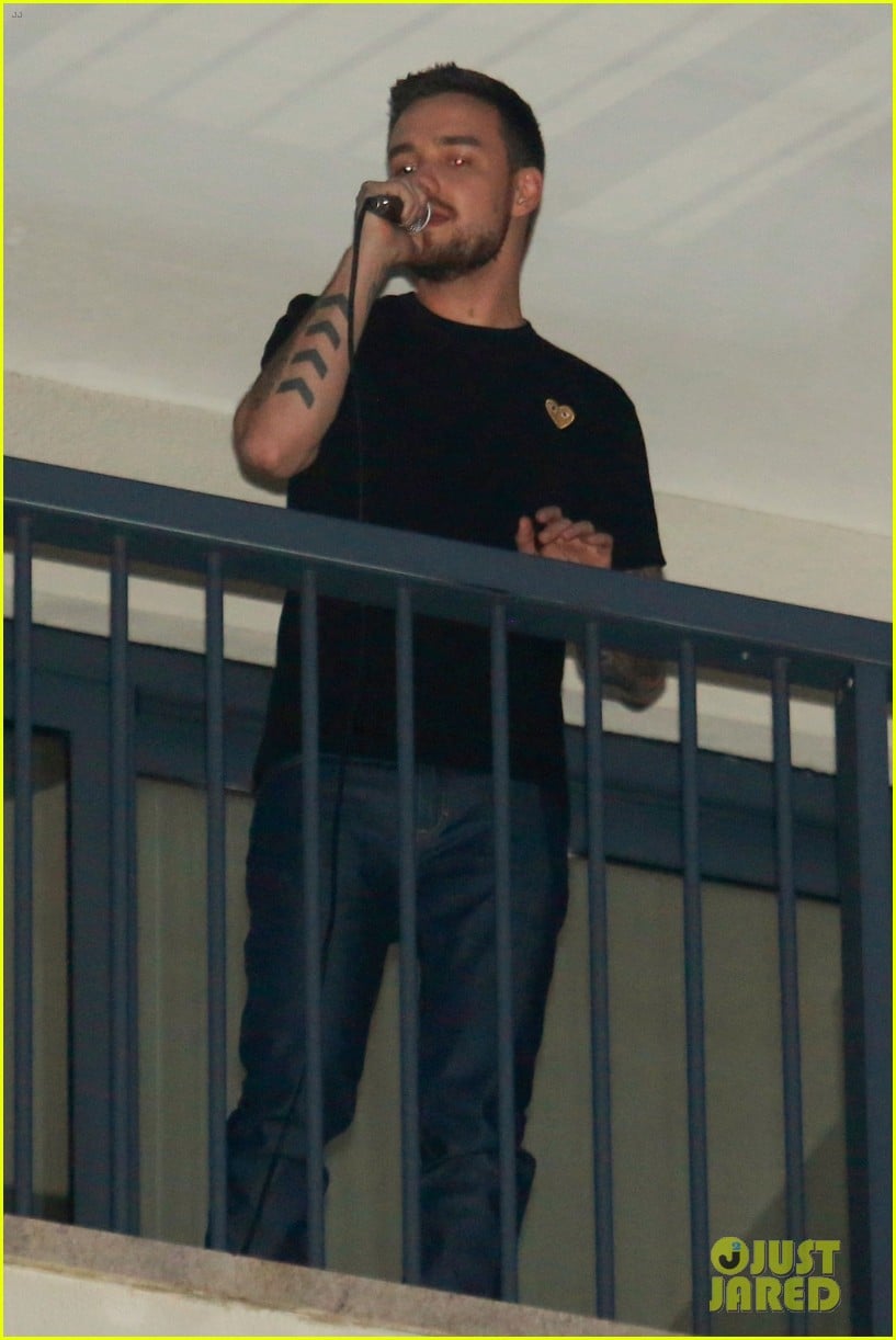 liam payne performs one directions little things from hotel balcony 01