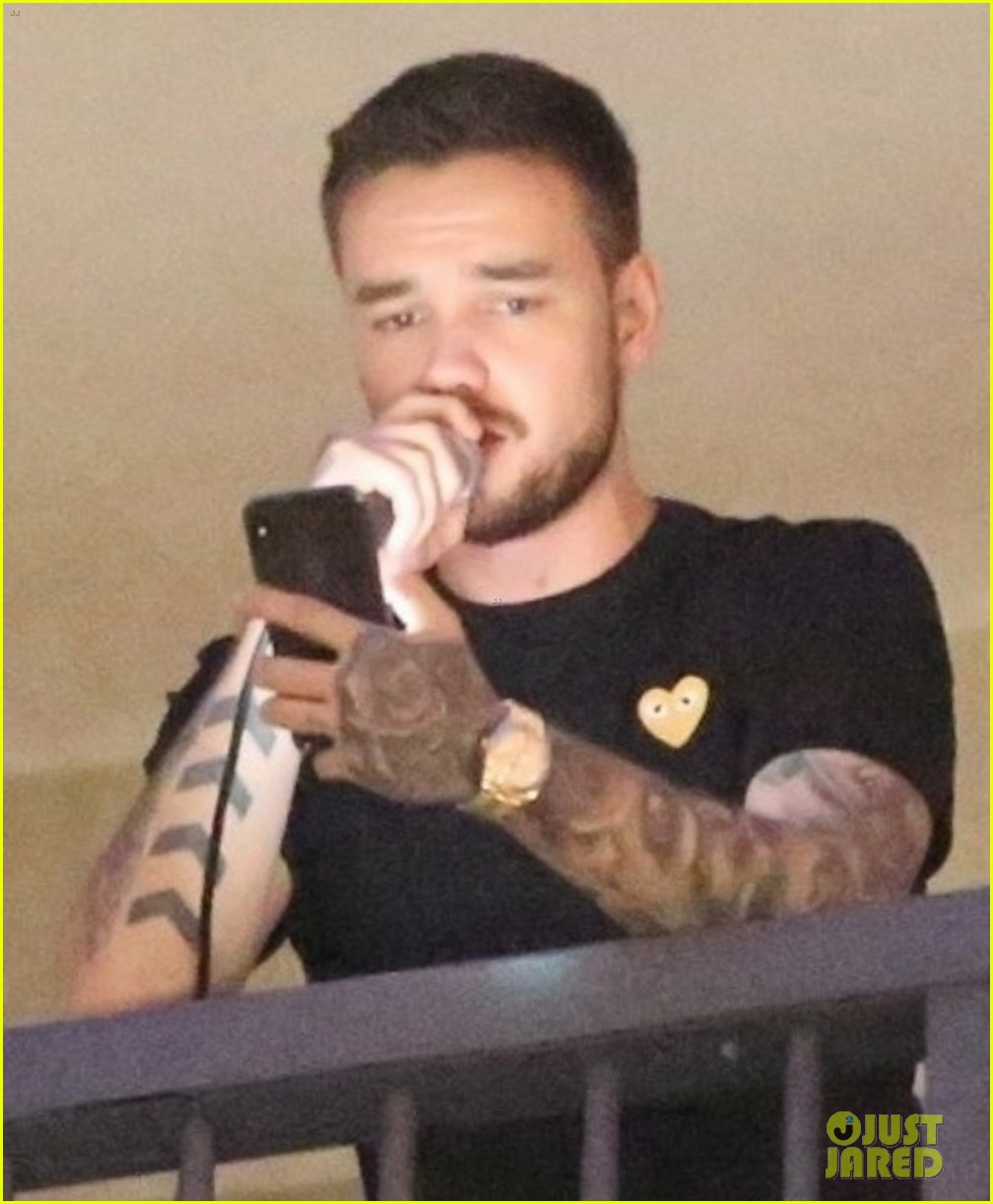 liam payne performs one directions little things from hotel balcony 02