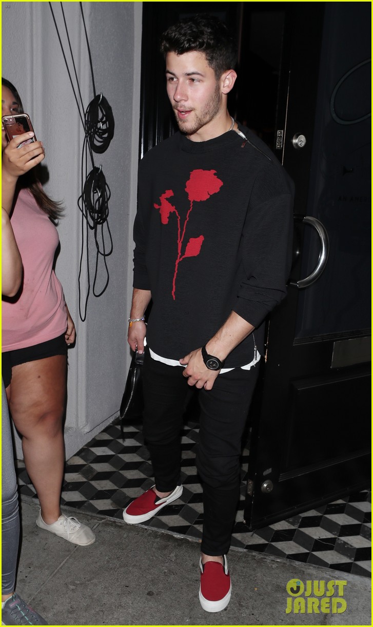 Full Sized Photo of nick jonas has rose for fans at craigs restaurant