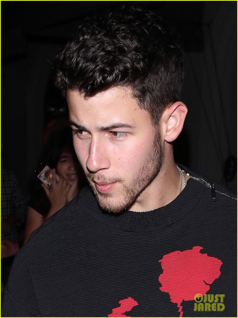 Nick Jonas Has A Rose For Fans Waiting Outside Restaurant Photo