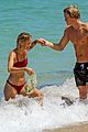 cody simpson hits the beach with girlfriend clair wuestenberg 06