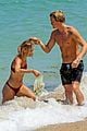 cody simpson hits the beach with girlfriend clair wuestenberg 21