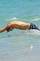 cody simpson hits the beach with girlfriend clair wuestenberg 34