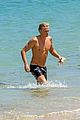 cody simpson hits the beach with girlfriend clair wuestenberg 35