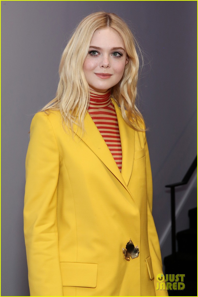 Elle Fanning Brightens Up A Rainy Day With Her Yellow Suit at 'I Think