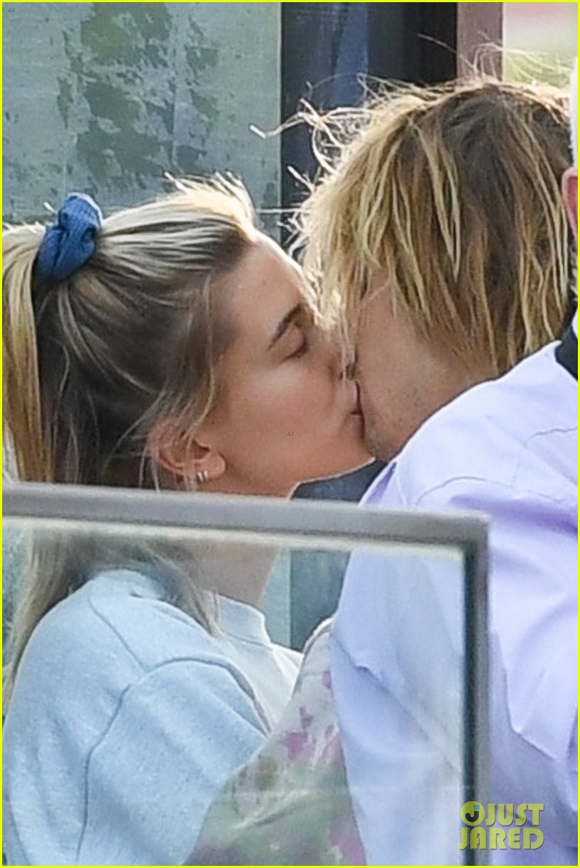 Justin Bieber and Hailey Baldwin share a 'mask kiss' as they step