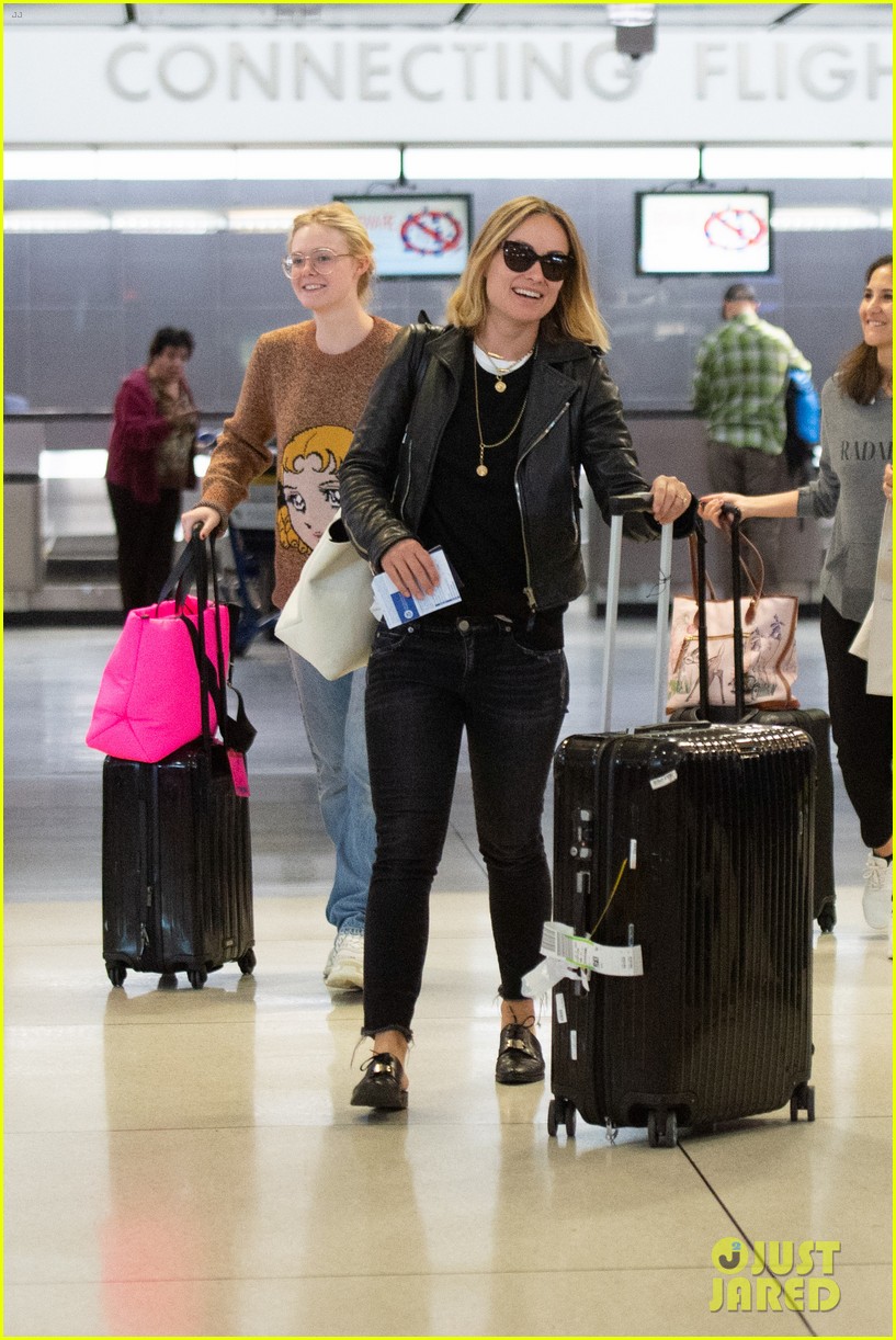 Elle Fanning Flashes a Grin While Landing in NYC After Paris Fashion