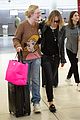 elle fanning and olivia wilde share a laugh at jfk airport with jason sudeikis01