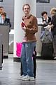 elle fanning and olivia wilde share a laugh at jfk airport with jason sudeikis10