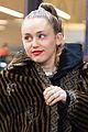 miley cyrus bundles up for flight home from london 01