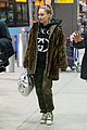 miley cyrus bundles up for flight home from london 02