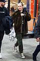 miley cyrus bundles up for flight home from london 03