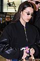 bella hadid jets from milan to nyc with cute cherry tote 06