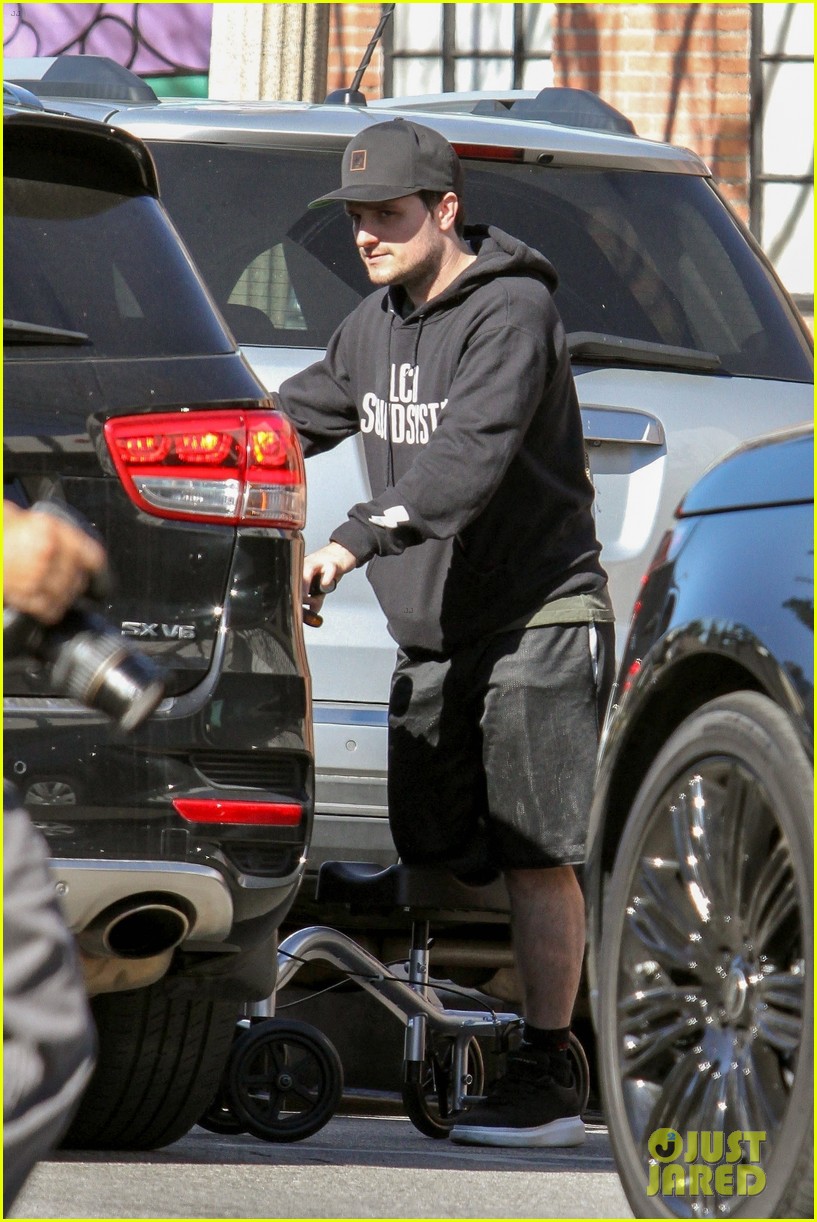josh hutcherson makes a coffee run on his injured leg 01
