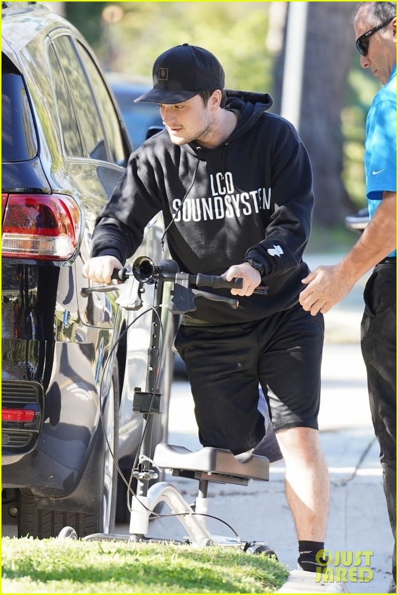 josh hutcherson makes a coffee run on his injured leg 04