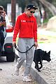 kristen stewart dons bright red sweatshirt for hike with her dog 01