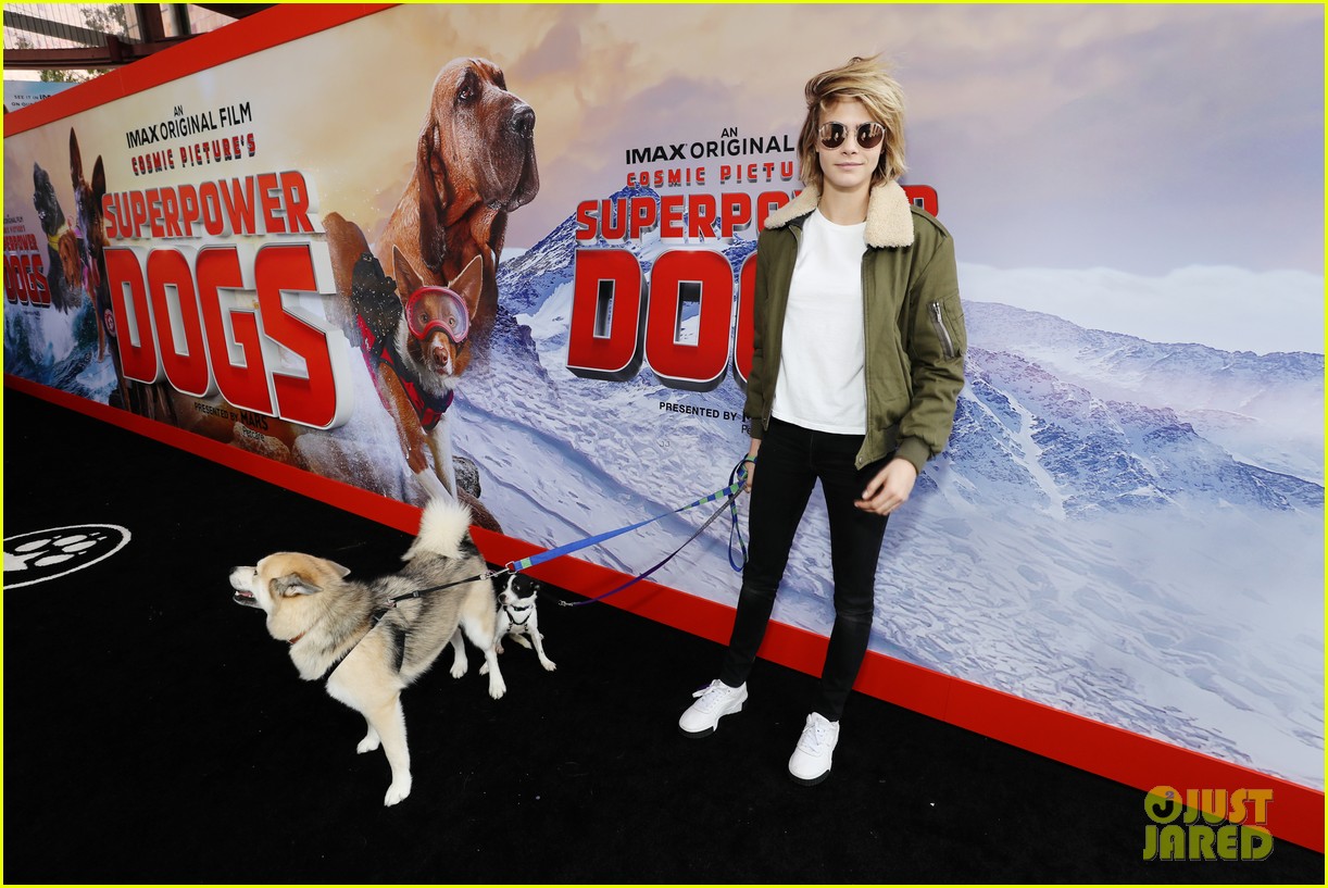 Cara Delevingne Cozies Up to Her Dog at 'Superpower Dogs' Premiere