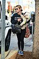lucy hale takes her pup for a walk in la 01