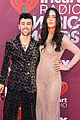 max wife emily skip traditional red carpet attire to iheartradio music awards 02