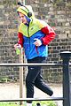 harry styles sports colorful jacket while jogging in london 01