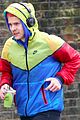 harry styles sports colorful jacket while jogging in london 02