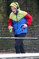 harry styles sports colorful jacket while jogging in london 03