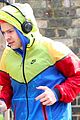 harry styles sports colorful jacket while jogging in london 04