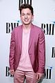 charlie puth charlotte lawrence walk carpet separately at bmi pop awards 01