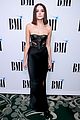 charlie puth charlotte lawrence walk carpet separately at bmi pop awards 02