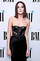 charlie puth charlotte lawrence walk carpet separately at bmi pop awards 10