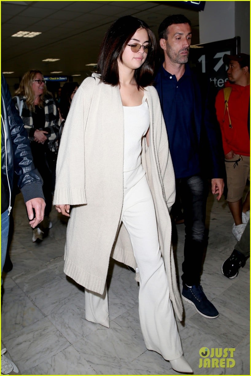 Full Sized Photo of selena gomez arrives at airport for cannes 01