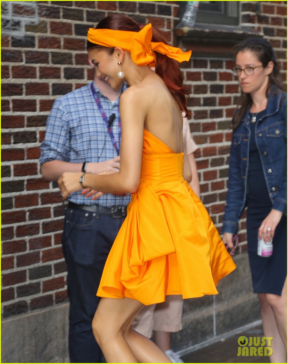 Zendaya Stuns In Hot Orange Dress While Promoting 'Spider-Man: Far From