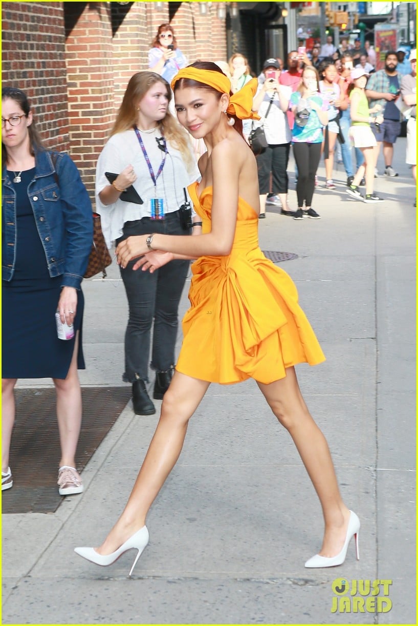 Zendaya Stuns In Hot Orange Dress While Promoting 'Spider-Man: Far From