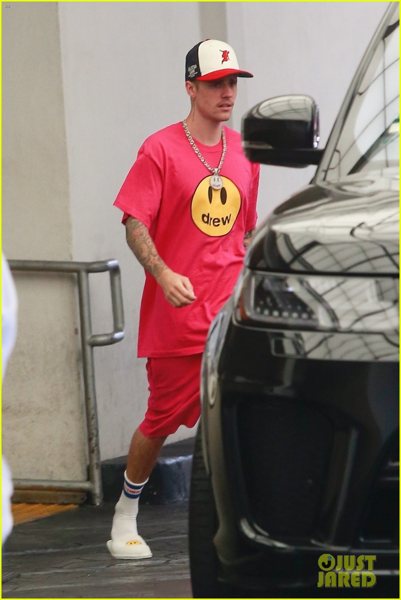 Full Sized Photo of justin and hailey bieber pop in red outfits while ...