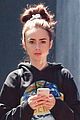 lily collins finds her own lancome ad in paris 03