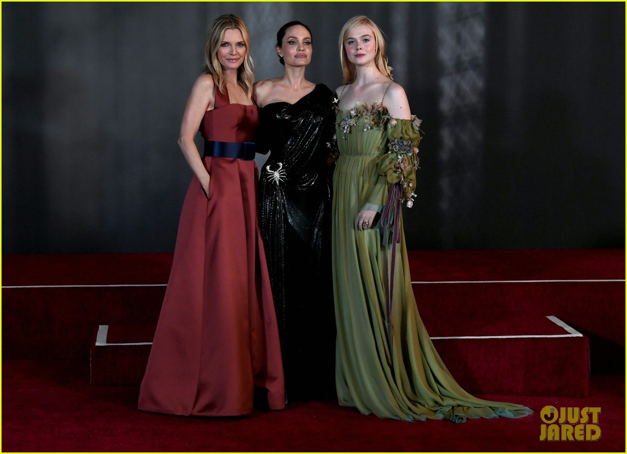elle fanning accessorizes green gown with blood drops at maleficent 2 world premiere 17