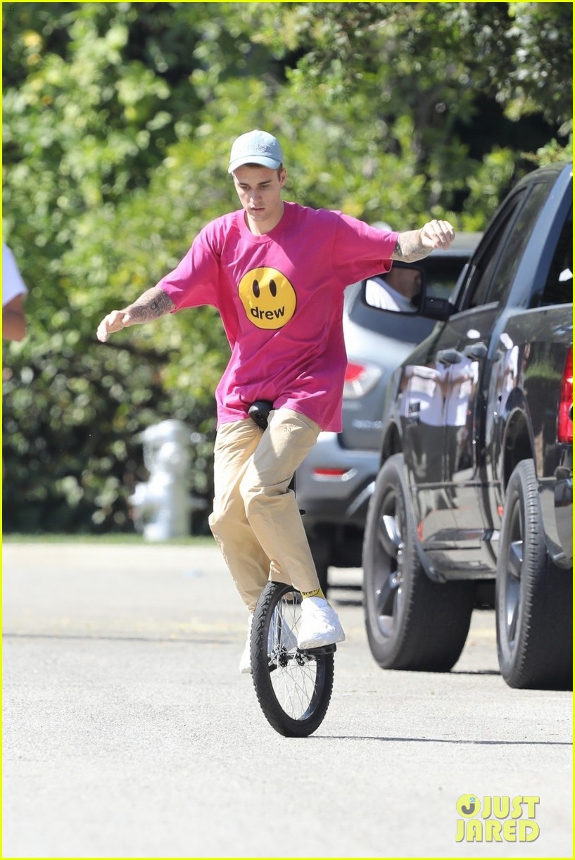 Justin Bieber Takes a Spill on His Unicycle, But Gets Right Back Up ...