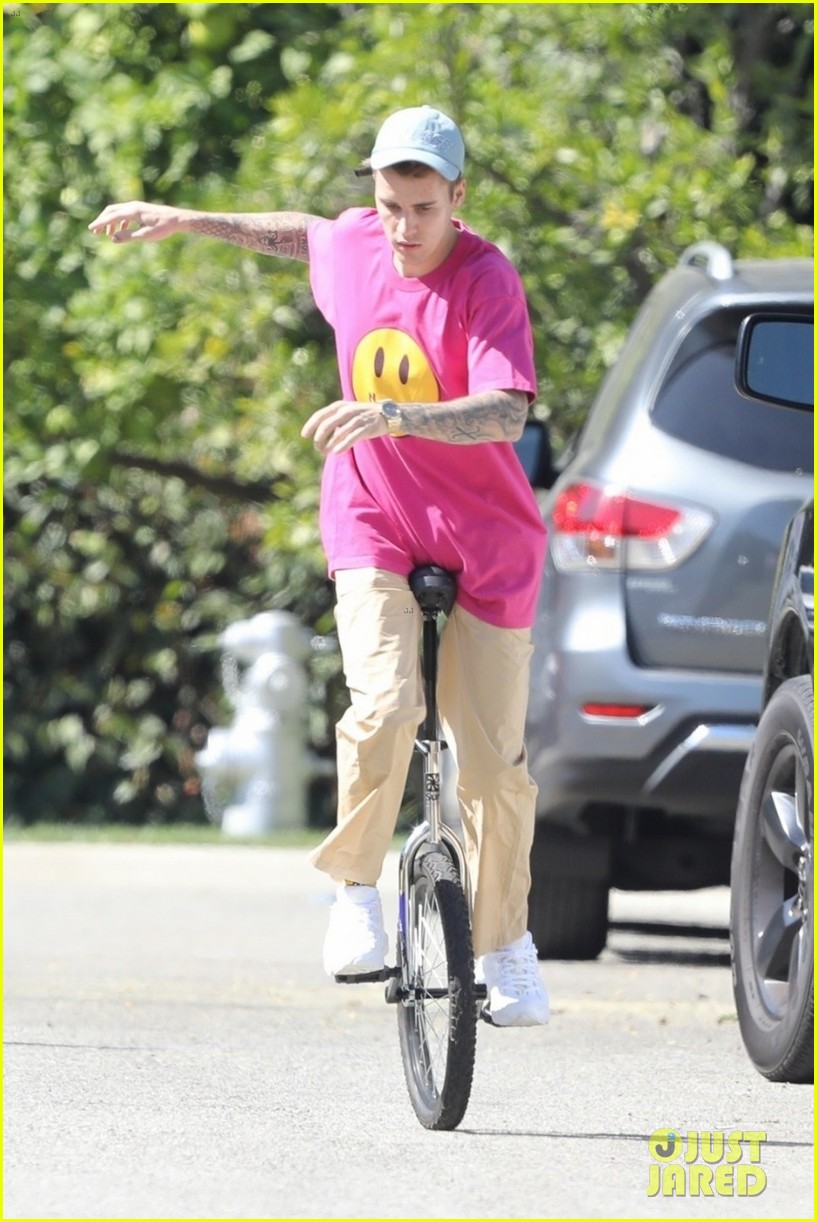 Justin Bieber Takes a Spill on His Unicycle, But Gets Right Back Up ...