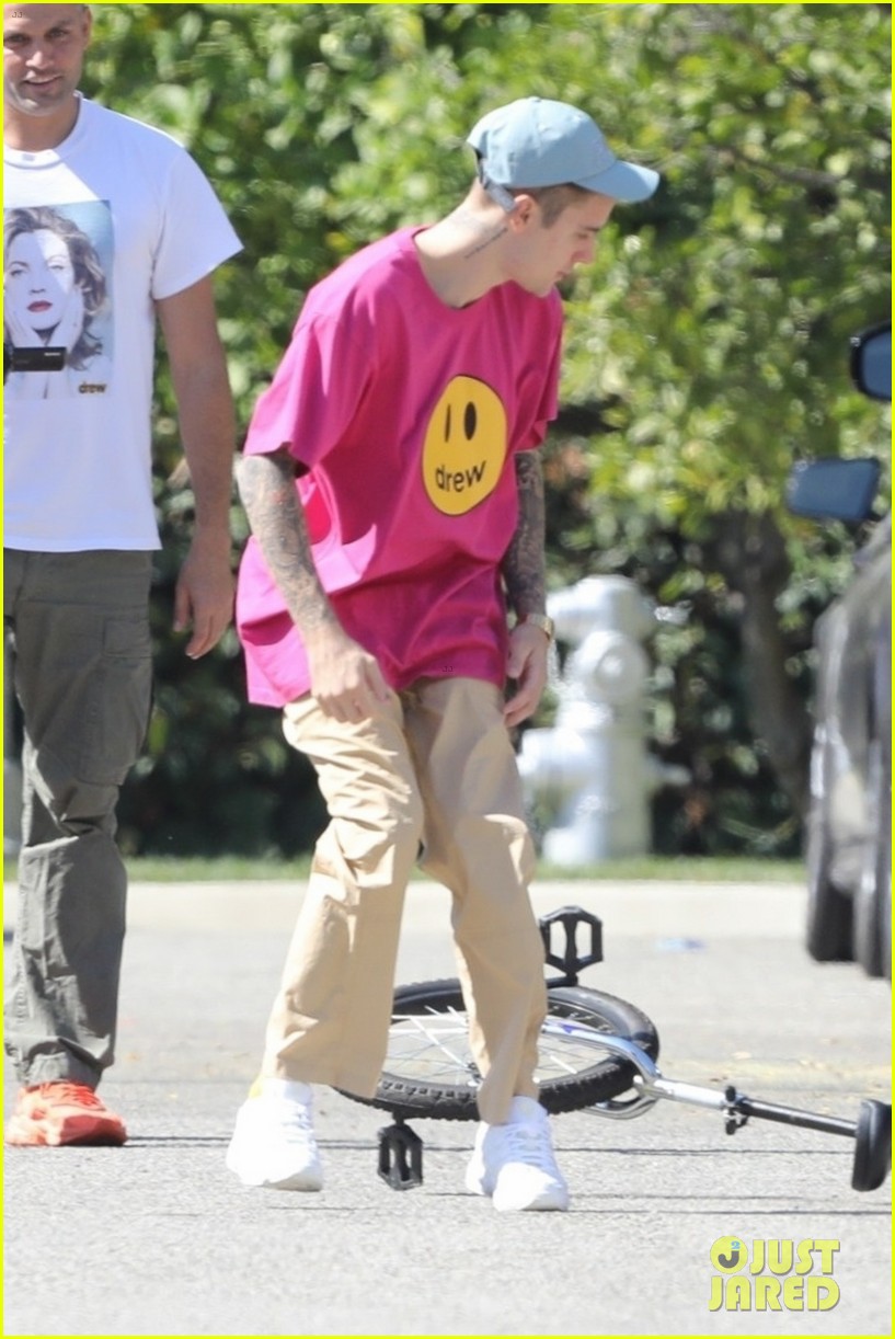 Justin Bieber Takes a Spill on His Unicycle, But Gets Right Back Up ...