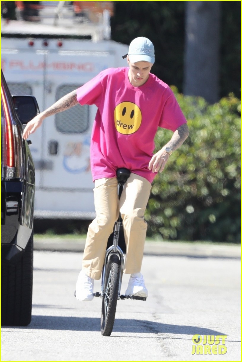 Justin Bieber Takes a Spill on His Unicycle, But Gets Right Back Up ...