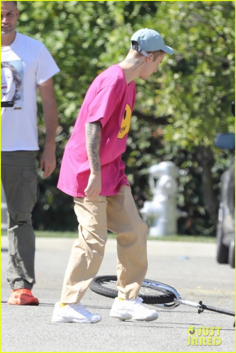 Justin Bieber Takes a Spill on His Unicycle, But Gets Right Back Up ...