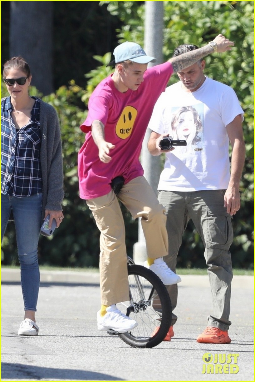 Justin Bieber Takes a Spill on His Unicycle, But Gets Right Back Up ...