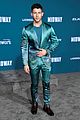 nick jonas sports silk teal suit for midway premiere 01